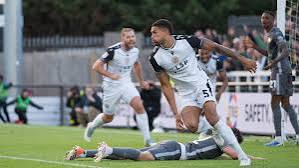Shuwmi with a towering header to get Bromleys 2 goal cushion back